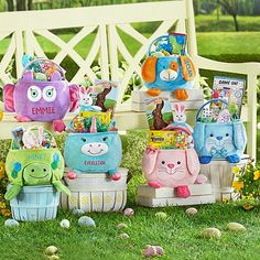 a group of children's toys sitting on top of a grass covered park bench