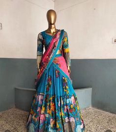 lehenga set  |womens kalamkari lehenga choli |crop top lehenga set |designer kalamkari lehenga dupatta |blue pink  wedding lehenga choli | blue hand painted kalamkari lehenga usa Women's lehenga set /kalamkari embroidered bluelehenga skirt/voggish      lehengas are one of the beautiful and versatile traditional attires of india !! we carry such pieces in budget with great quality that can be styled in multiple ways with different outfits !!       Here is Beautiful lehenga set in blue color and pink color in pure silk hand painted authentic kalamkari set in which skirt has hand painted multi color big border pattern  paired with matching full sleeve hand embroidered and hand painted kalamkari blouse as shown!! This set comes with contrast pink hand painted dupatta with  all over kalamkari h Pink Kalamkari Dupatta, Fitted Kalamkari Print Dupatta For Designer Wear, Fitted Anarkali Sharara With Kalamkari Print, Multicolor Lehenga With Kalamkari Print In Traditional Drape, Traditional Drape Multicolor Lehenga With Kalamkari Print, Unstitched Lehenga With Kalamkari Print, Unstitched Bollywood Lehenga With Kalamkari Print, Anarkali Style Kalamkari Print Floor-length Lehenga, Semi-stitched Kalamkari Print Lehenga