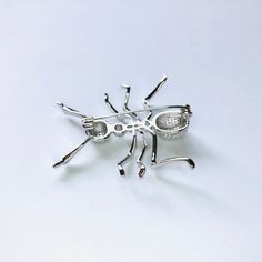 Shiny silver-tone CZ crystal ant brooch Not intended for children ages 13 and under. Also, for many items we can accommodate large orders, so please send us a message. Silver Novelty Pins For Gifts, Silver Novelty Brooches For Gifts, Star Darlings, Pretty Pins, Animal Brooch, Pin Jewelry, Cat Pin, Shiny Silver, Ants