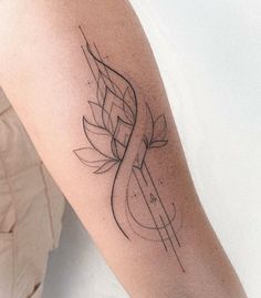 a woman's arm with a tattoo design on the left side of her body