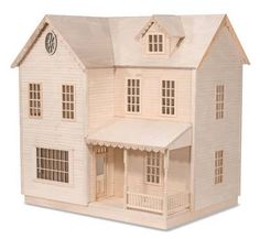 a wooden dollhouse with a clock on the top of it's roof and porch