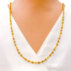 This luxurious necklace is skillfully crafted with 22k gold, totaling 11.8 grams, with 11.0 grams in gold and 0.8 grams in Tulsi beads. It showcases a radiant yellow gold finish and measures 26 inches in length, seamlessly designed without a lock for uninterrupted elegance. The subtle inclusion of Tulsi beads adds a touch of spiritual significance, making this piece not only a fashion statement but also a nod to cultural heritage. Ideal for those seeking jewelry that blends sophistication with m Gold Plated Temple Necklace With Tilla, Gold Plated Yellow Gold Temple Necklace With Tilla, Gold Necklaces With Tilla Detailing In 22k Gold, Yellow Gold Temple Necklace With Tilla, Gold Plated, 22k Gold Necklaces With Tilla Detailing, Yellow Gold Temple Necklace With Tilla Detailing, 22k Gold Necklace With Tilla, Gold Necklaces With Tilla Detailing, Gold Temple Jewelry Necklace With Beaded Chain