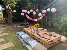 a picnic table set up with food and decorations