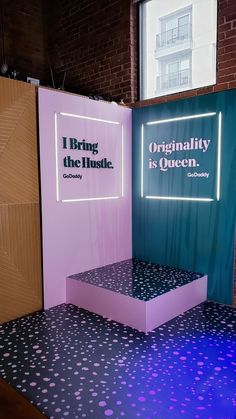 a display in the middle of a room with polka dot flooring and purple lighting