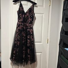 A Black Midi Dress. Made With Pink Cherry Blossom Sequins. Dress Has Never Been Worn Out ( Only Tried On) And Has The Original Bagging It Came In. Runs A Little Small. Hidden Back-Zip Closure V-Neck Sleeveless V-Back Lined 100% Polyester Hand Wash, Dry Flat Cherry Blossom Dress, Pink Cherry Blossom, Sequins Dress, Pink Cherry, Dress The Population, Black Midi, Original Bags, Black Midi Dress, Cherry Blossom