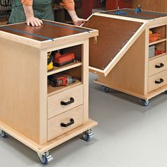 a man working on a workbench in a woodworking shop with drawers and tools