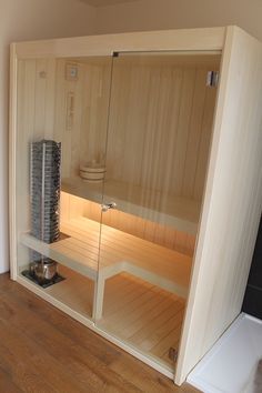 an empty sauna in the corner of a room