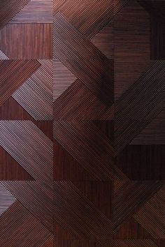 an abstract wooden background with lines and shapes in brown, black and white colors that appear to be made from wood veneers