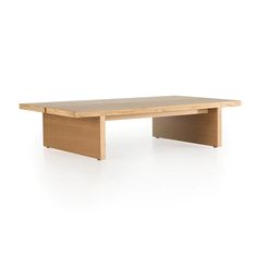 a wooden table sitting on top of a white floor