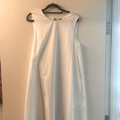 This Never Worn Dress Still Has The Tag On It And Is An Elegant Long Dress White Cotton Shift Midi Dress, Sleeveless Shift Midi Dress For Day Out, Shift Midi Dress For Daywear, White Shift Midi Dress, Sleeveless Shift Midi Dress For Daywear, Unlined A-line Midi Dress For Daywear, White Shift Sleeveless Dress, White Sleeveless Shift Dress, Sleeveless Unlined Dress For Brunch