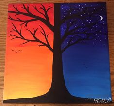 a painting of a tree with the moon and stars in the sky above it on a wooden surface