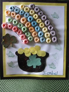 a card made to look like a pot of gold coins with a rainbow in the background