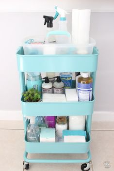 a blue cart filled with lots of bathroom items