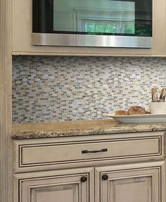 a microwave oven sitting on top of a kitchen counter