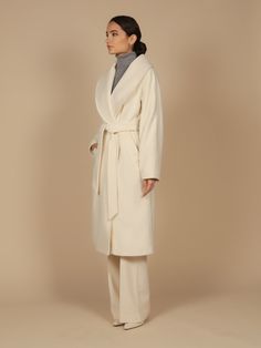 The one, the only, the ultimate staple in the wardrobe of any lady.  This timeless piece is crafted using the finest double 100% virgin Italian and cashmere blend fabric (90% virgin wool, 10% cashmere), with an incredibly chic oversized fit. Hand picked stitching along the collar, sleeves, belt, pockets and back give this piece the opulent finish that a piece of this exquisite standard deserves. Tie the matching belt for an unremarkably feminine hourglass silhouette, or simply close the buttons Pick Stitch, Trench Coat Dress, Silk Coat, Faux Fur Hat, Hourglass Silhouette, Cashmere Fabric, Outfit Formulas, Shades Of Beige, Cashmere Coat