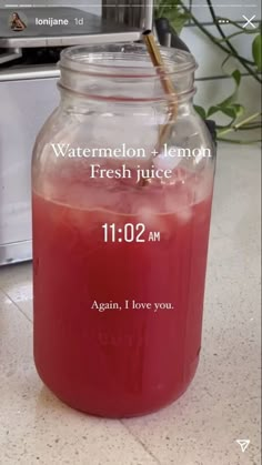 a jar filled with watermelon and lemon fresh juice