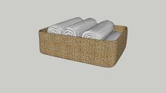 a basket with three rolls of white towels in it on a gray background, and the bottom half is empty