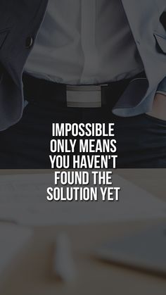 a man wearing a suit and tie with the words impossiblely only means you haven't found the solution yet