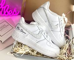 Make your day extra special with these beautiful and unique custom bridal sneakers! * Brand New 100% Authentic sneakers! * FREE SHIPPING within the US territory!  * Rhinestones/pearls Swoosh Bridal Custom made-to-order sneaker. * Hand-painted lettering on the outer sides of each shoe. Get them Personalized! - Size Guide- C (Child) Y (Youth) W (Women) M (Men.) - Acrylic Waterproof paint - ALWAYS Hand-Pianted, we never use stickers to make sure the shoes last a long time! - Available in Low, Mid, Customizable White Sneakers For Gift, Customized White Sneakers As A Gift, Customized White Sneakers As Gift, Customized White Sneakers For Gift, White Custom Lace-up Sneakers As Gift, White Lace-up Custom Sneakers For Gift, White Lace-up Custom Sneakers As Gift, Bridal Sneakers, Waterproof Paint