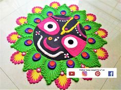 this is an image of a colorful rangolite decoration for diwaling on the floor