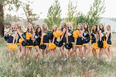 a group of cheerleaders posing for a photo