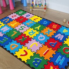 a child's rug with letters and numbers on it