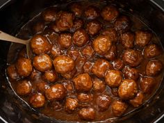 the meatballs are being cooked in the slow cooker