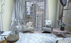 a living room filled with furniture and a baby crib