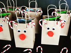 paper bags decorated with candy canes and reindeer noses