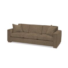 a brown couch sitting on top of a white floor