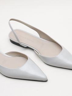 Editor's NotesKAREN WHITE presents slingback flats made of glossy cracked leather. It gives a feminine mood with a slim silhouette and details. - Glossy cracked leather- Slingback style- Pointed toes- Slim silhouette- Inner banding- Classic and feminine mood Measurements (in.)- Size: KR 225MM (US 5.5) ~ KR 250MM (US 8)- Heel: 0.39 in.*Fit true to size Composition & Care- Material: Shell: Cow Leather / Outsole: Rubber- Natural leather may have fine scratches and wrinkles- Brigh White Flat Slingback Pumps, White Leather Flat Slingback Pumps, Elegant Everyday Leather Slingback Pumps, Elegant Everyday Leather Slingback Sandals, Kurta Designs Women, Slingback Flats, Kurta Designs, Beautiful Shoes, Velvet Dress