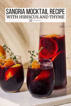 sangria cocktail recipe with hibiscus and thyme in two glasses on a tray