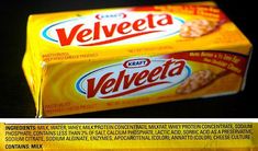 a box of velveeta cereal sitting on top of a black countertop