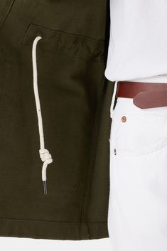 Blending form and function, this organic cotton utility jacket is a versatile layering piece. Your new go-to. Utility jacket with hidden button placket, patch pockets, and interior drawstring waist for fit 100% Organic Cotton Twill Unlined Ethically Made in Peru Part of a matching set Cotton Utility Jacket For Layering, Khaki Cotton Outerwear For Layering, Versatile Khaki Cotton Outerwear, Green Cotton Utility Jacket For Everyday, Green Cotton Outerwear For Layering, Everyday Khaki Cotton Utility Jacket, Olive Cotton Utility Jacket, Olive Cotton Outerwear With Cargo Pockets, Utility Jacket