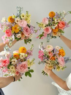 four brides holding bouquets of flowers in their hands