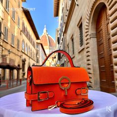 This bag has been made of the best genuine leather by local master crafters of Florence in Italy, designed for women who only accept premium Italian quality and luxury leather bags and modern Italian fashion. . Sizes: Width: 24 cm / 9.45 inches Height: 14 cm / 5.51 inches Depth: 6.30 cm / 2.48 inches Color: Orange . The Story Of This Bag: In the heart of Florence, where history and art converge in a tapestry of timeless beauty, there exists a boutique renowned for its exquisite Italian handmade Wife Carrying, Leather Bags For Women, Handmade Leather Bags, Luxury Leather Bag, Leather Bags Handmade, Historical Architecture, Mini Shoulder Bag, Anniversary Gift For Her, Leather Bags