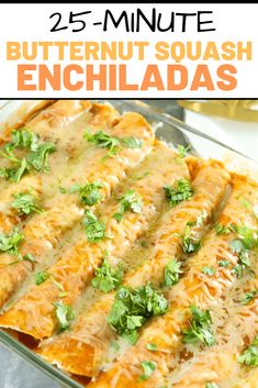 an enchilada dish with cheese and cilantro on top in a glass casserole dish