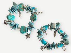 Beautiful stretchy set of bracelets features a harmonious blend of natural shells and beads in bright and pastel blue tones. Metallic charms inspired by nature - including sea stars, hearts, keys, leaves, and abstract designs - add a touch of whimsical sophistication. Both bracelets are equipped with sturdy clasps, ensuring a secure and comfortable fit. Whether worn together for a layered look or individually for subtle elegance, these bracelets are versatile accessories for any occasion. Great to wear in a city or town near the ocean, in the Summer by the pool, or while traveling abroad!  Each piece in this duo is meticulously handcrafted by local artisans, embodying the spirit of Colombia's rich culture and the serenity of its coastal landscapes. Elevate your jewelry collection with thes Bohemian Blue Shell Bracelets, Bohemian Blue Shell Bracelet, Turquoise Beaded Shell Bracelets, Blue Bohemian Beaded Shell Bracelets, Blue Shell Bohemian Bracelets, Blue Shell Beaded Bohemian Bracelet, Sea Stars, Abstract Designs, Inspired By Nature