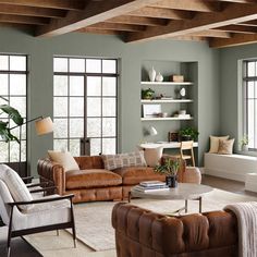 a living room filled with furniture next to a fire place in a fireplace mantel