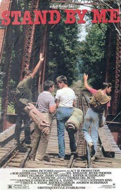 a movie poster for stand by me with three men walking across a bridge and one man holding