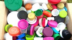 many different colored caps and lids are scattered together