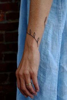 a person with a small tattoo on their wrist