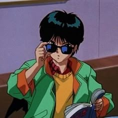 an anime character is reading a book while sitting at a table with his hand on his face