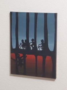 a painting of people riding bikes across a bridge in the woods at sunset or dawn