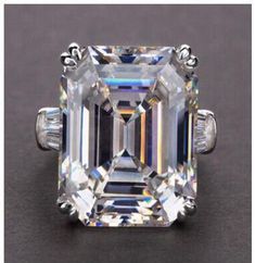 an emerald - cut diamond ring