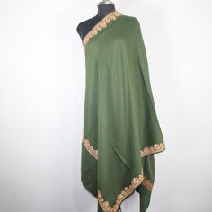 Kashmiri Tilla/Zari Embroidered Wool Shawl.This Shawl Is Made Of Fine Merino Wool Its Embroidered With Tilla Work.The Embroidery Done On This Is A Traditional Kashmiri Embroidery Known As 'Tilla Work''.Now Own A Rare Genuine Kashmiri Hand Embroidered Shawl Which Takes Many Months To Create, Unique In Design And Colour And, Have Never Been Replicated. Condition: Brand New Size: 40" X 80" (100 Cm X 200 Cm) Approx Colour: green Style: Shawl Wrap Material: Fine Merino Wool Design: dhordar Embroidery Green Embroidered Winter Kurta, Winter Embroidered Green Kurta, Winter Green Embroidered Kurta, Green Embroidered Kurta For Winter, Traditional Embroidered Green Shawl, Green Embroidered Shawl For Festivals, Green Traditional Pashmina Shawl, Traditional Green Pashmina Shawl Dupatta, Ceremonial Embroidered Jamawar Shawl