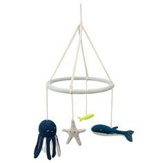 a baby crib mobile with an octopus, fish and starfish