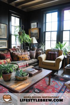 a living room filled with lots of furniture and plants on top of a coffee table