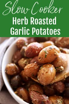 a white bowl filled with roasted garlic potatoes on top of a gray cloth and text overlay reads slow cooker herb roasted garlic potatoes