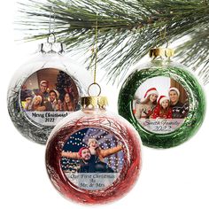 three ornaments hanging from a christmas tree with two people in the center and one man on the other side